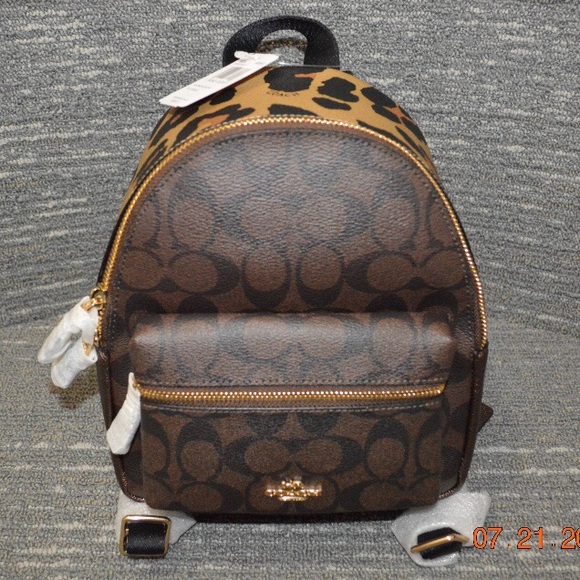 Coach Handbags - Coach NWT Mini Charlie Backpack Signature Leopard